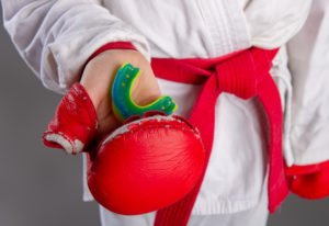 Karate Kid holding mouth guard